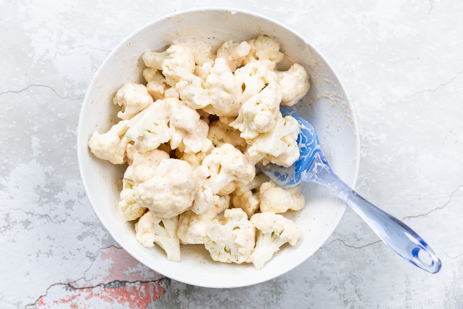 Battered Cauliflower for Our Sticky Sesame Cauliflower in a white bowl