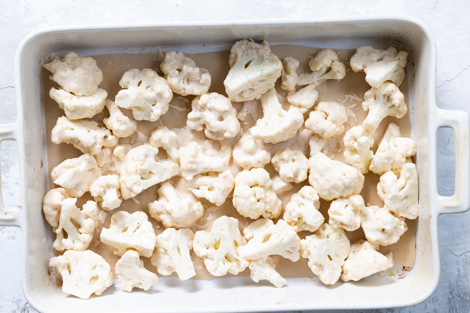 Battered Cauliflower for Our Sticky Sesame Cauliflower in a white baking dish