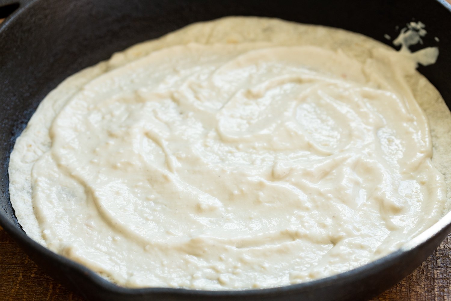 Cashew Mozzarella Cream Spread on a tortitlla for our Vegan Mushroom Quesadilla