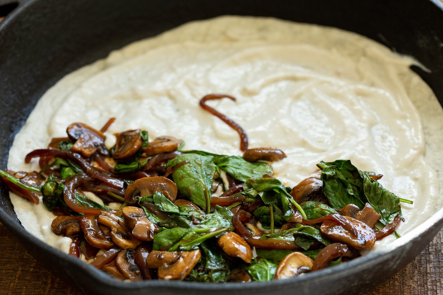 Mushroom Spinach mixture on the cashew mozzarella for our Vegan Mushroom Quesadilla