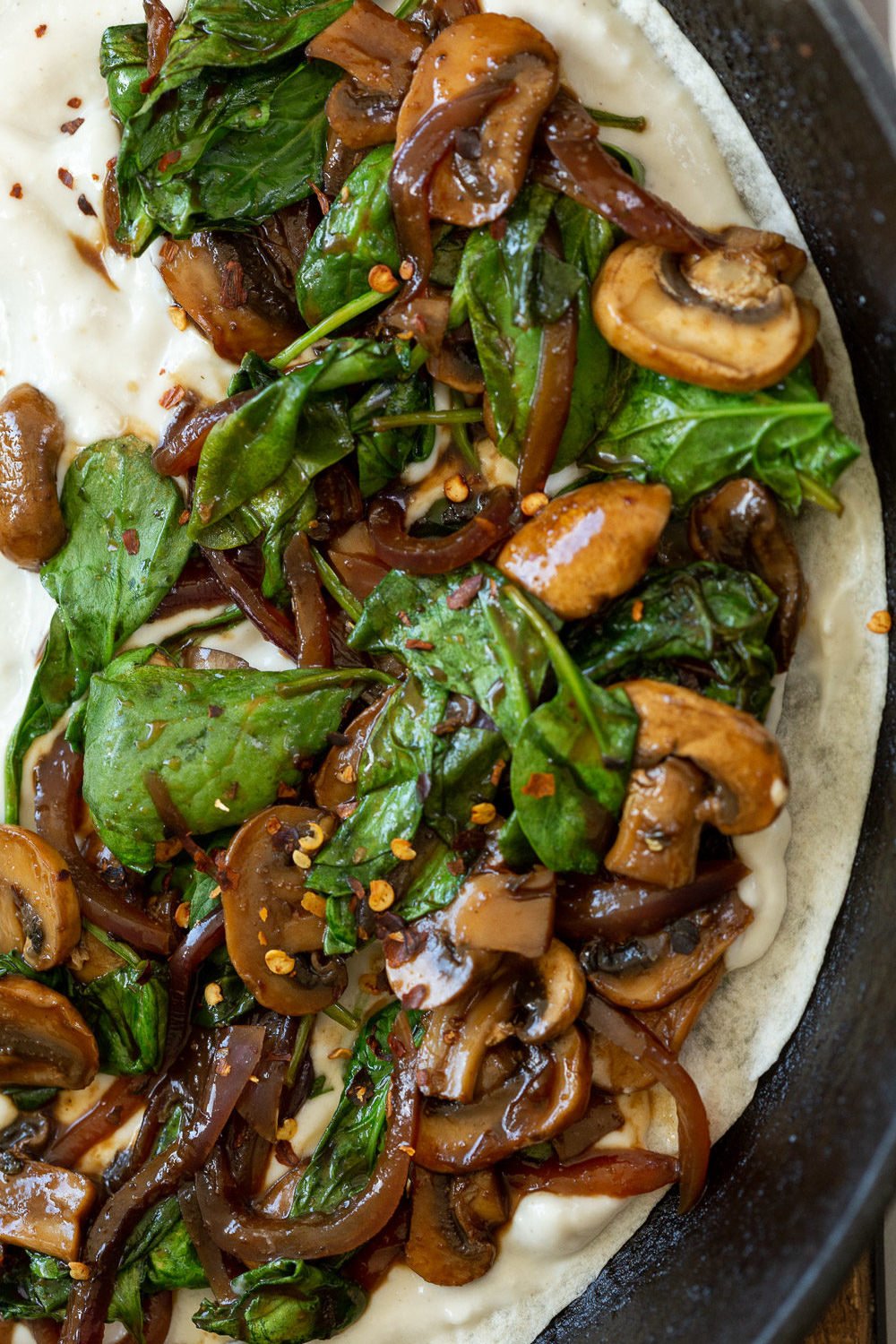 Mushroom Spinach mixture on the cashew mozzarella for our Vegan Mushroom Quesadilla