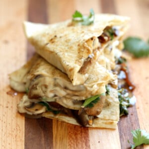 Grilled and sliced Vegan Mushroom Quesadilla on Wood board