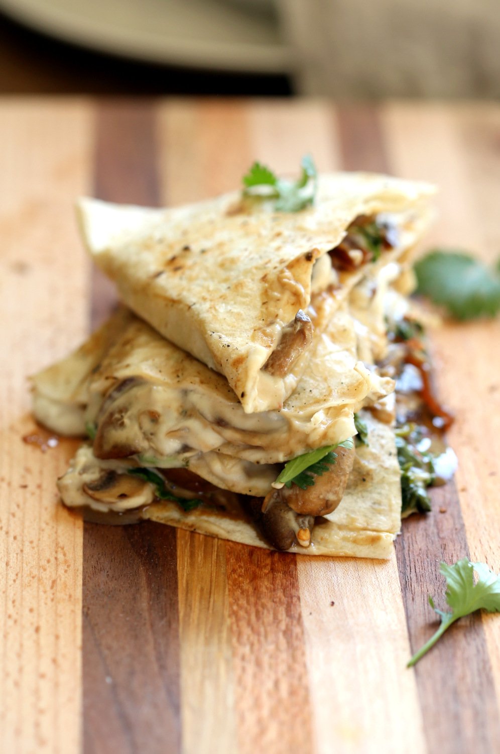 Grilled and sliced Vegan Mushroom Quesadilla on Wood board