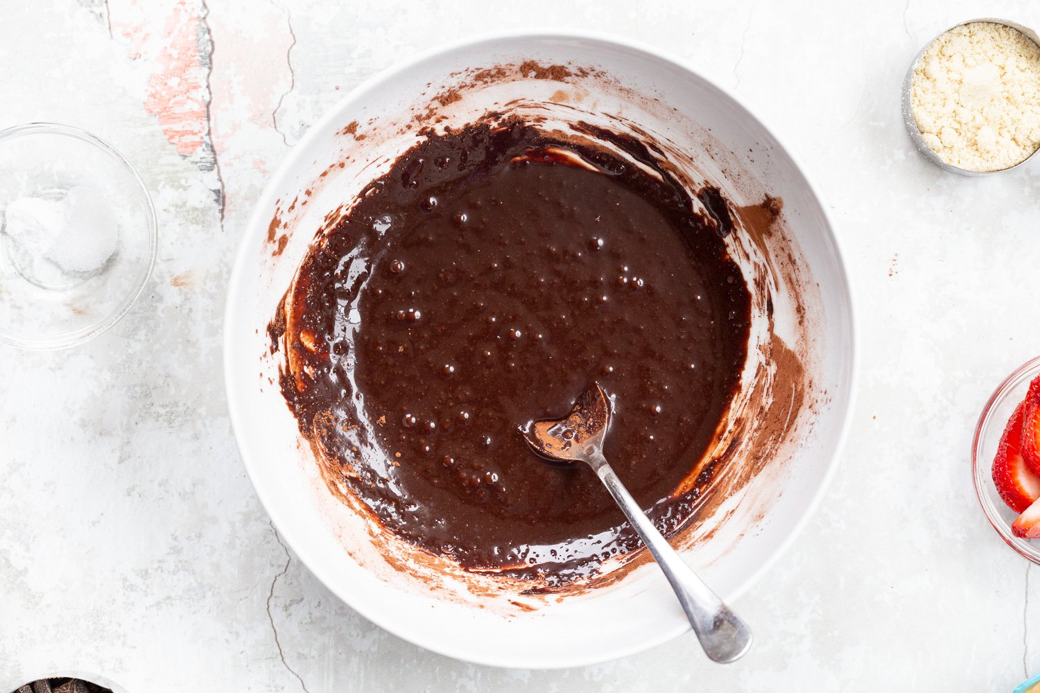 Wet chocolate mixture for our Vegan Strawberry Brownies in a white bowl