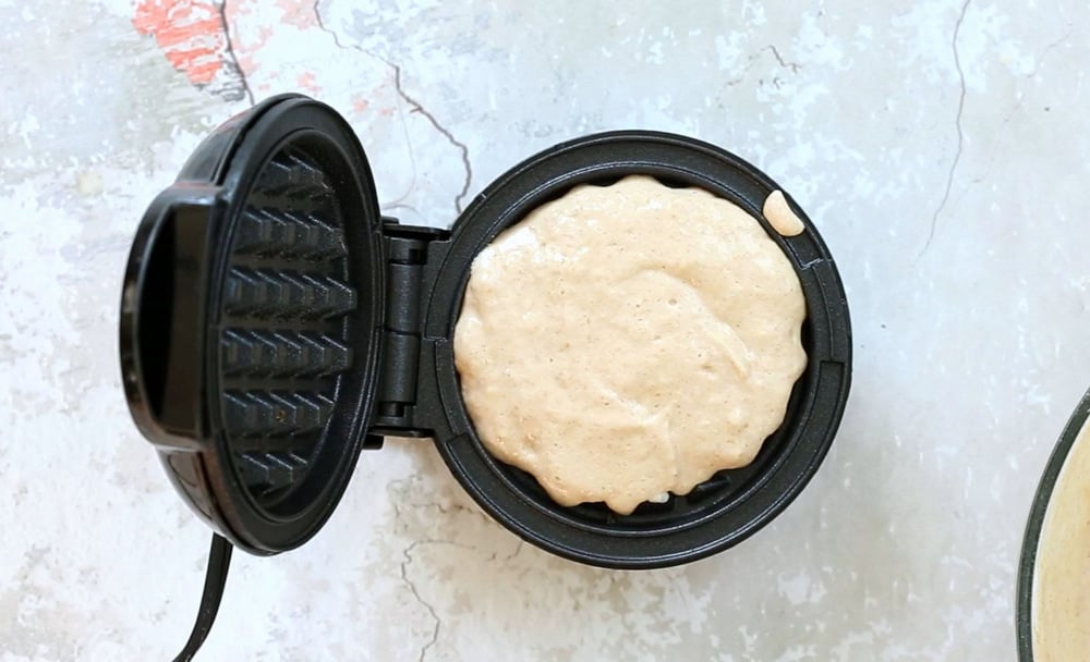 Batter of our Vegan Waffles in a waffle maker