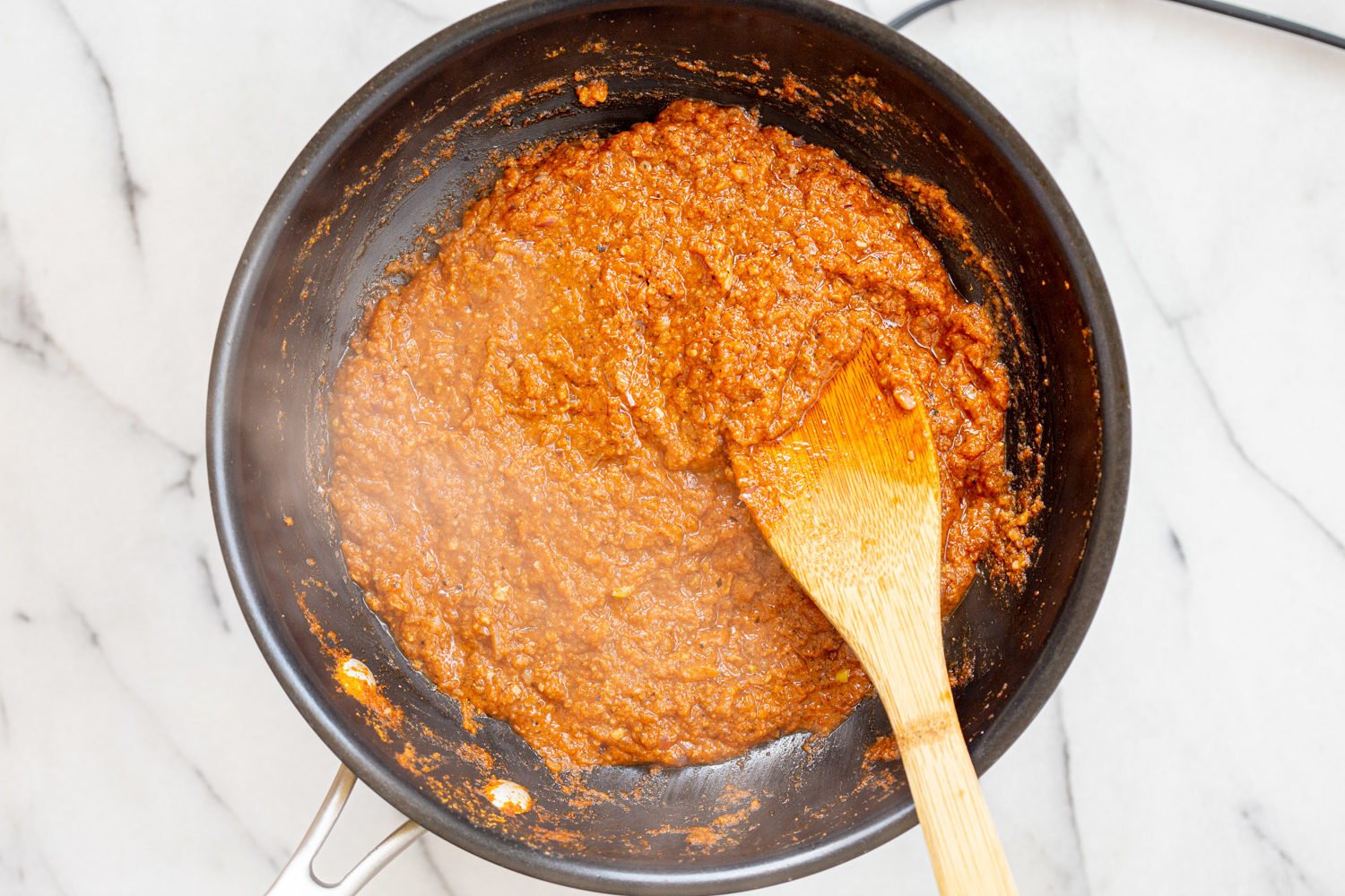 Sauce for our Vegan Keema Madras on a black skillet