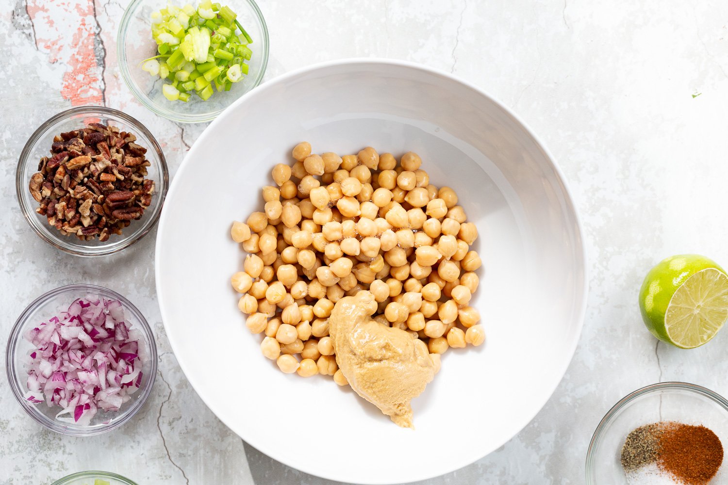 Ingredients for our Chickpea Tahini Salad Sandwich in a white bowl