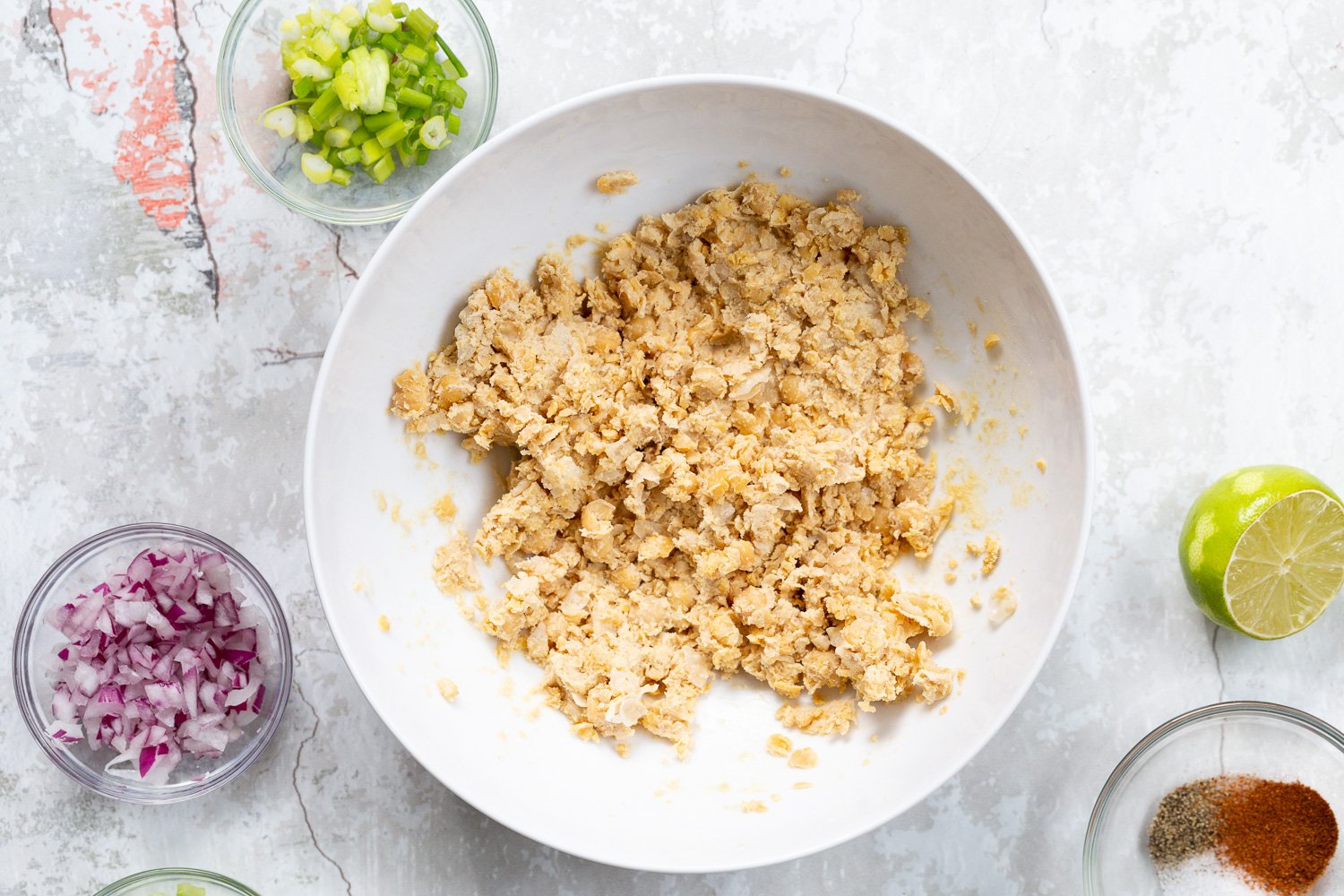 Mashed Chickpeas and Tahini for our Chickpea Tahini Salad Sandwich in a white bowl