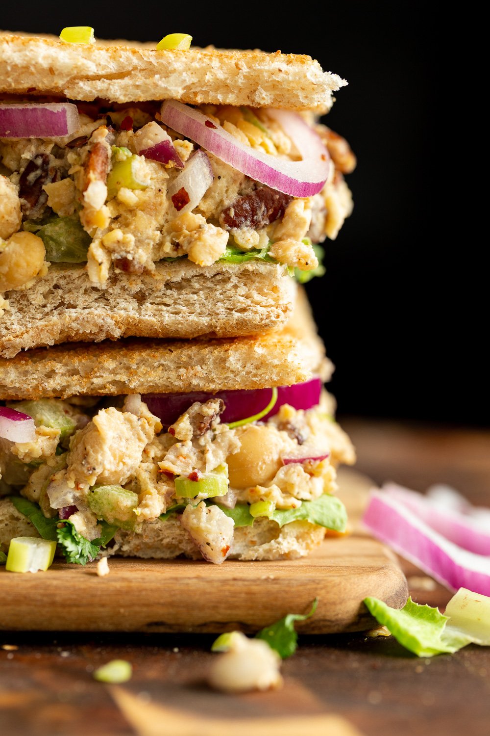 Our Chickpea Tahini Saladi n a Sandwich on wood board