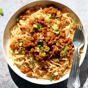 Sesame Noodles with Lemongrass Tempeh Crumbles in a white bowl