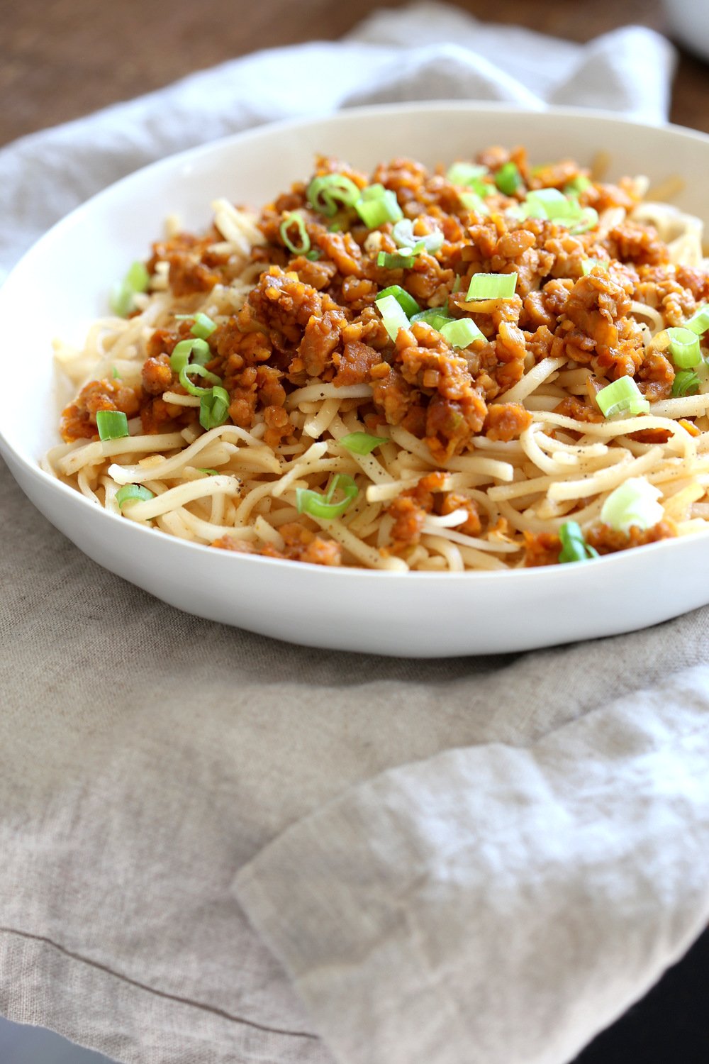 Sesame Noodles with Lemongrass Tempeh Crumbles in a white bowl