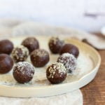 Our Raw Vegan Brownie Bites on white speckled plate