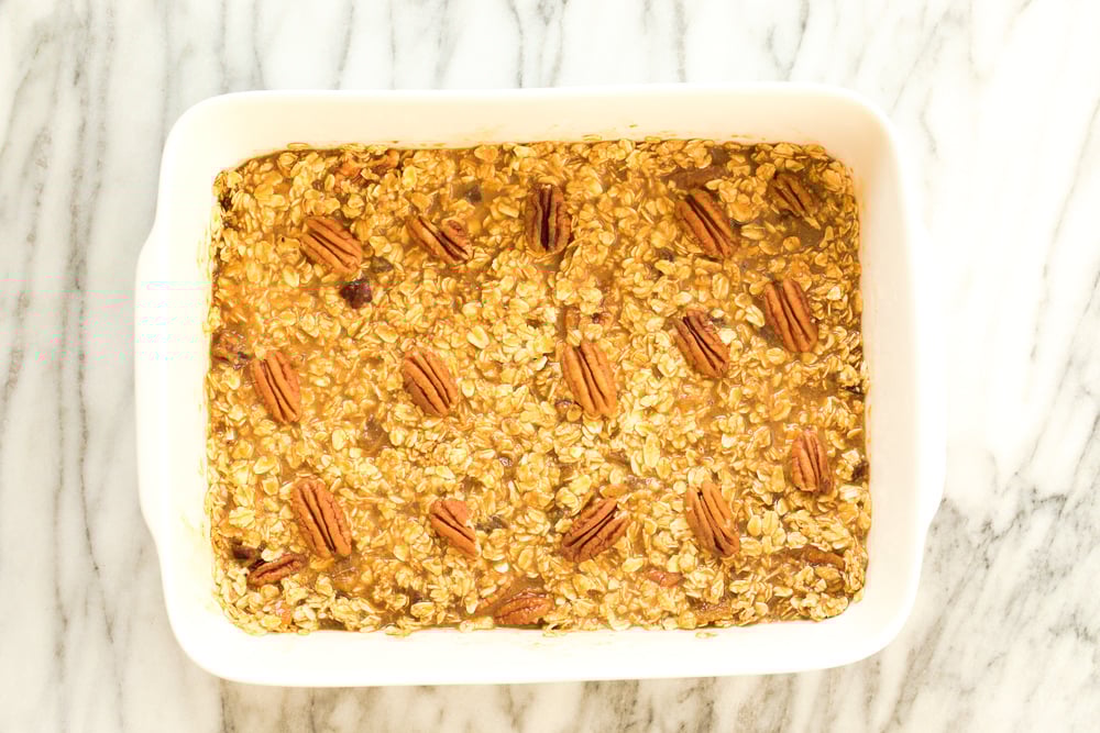 Vegan Gingerbread Baked Oatmeal in a white baking dish