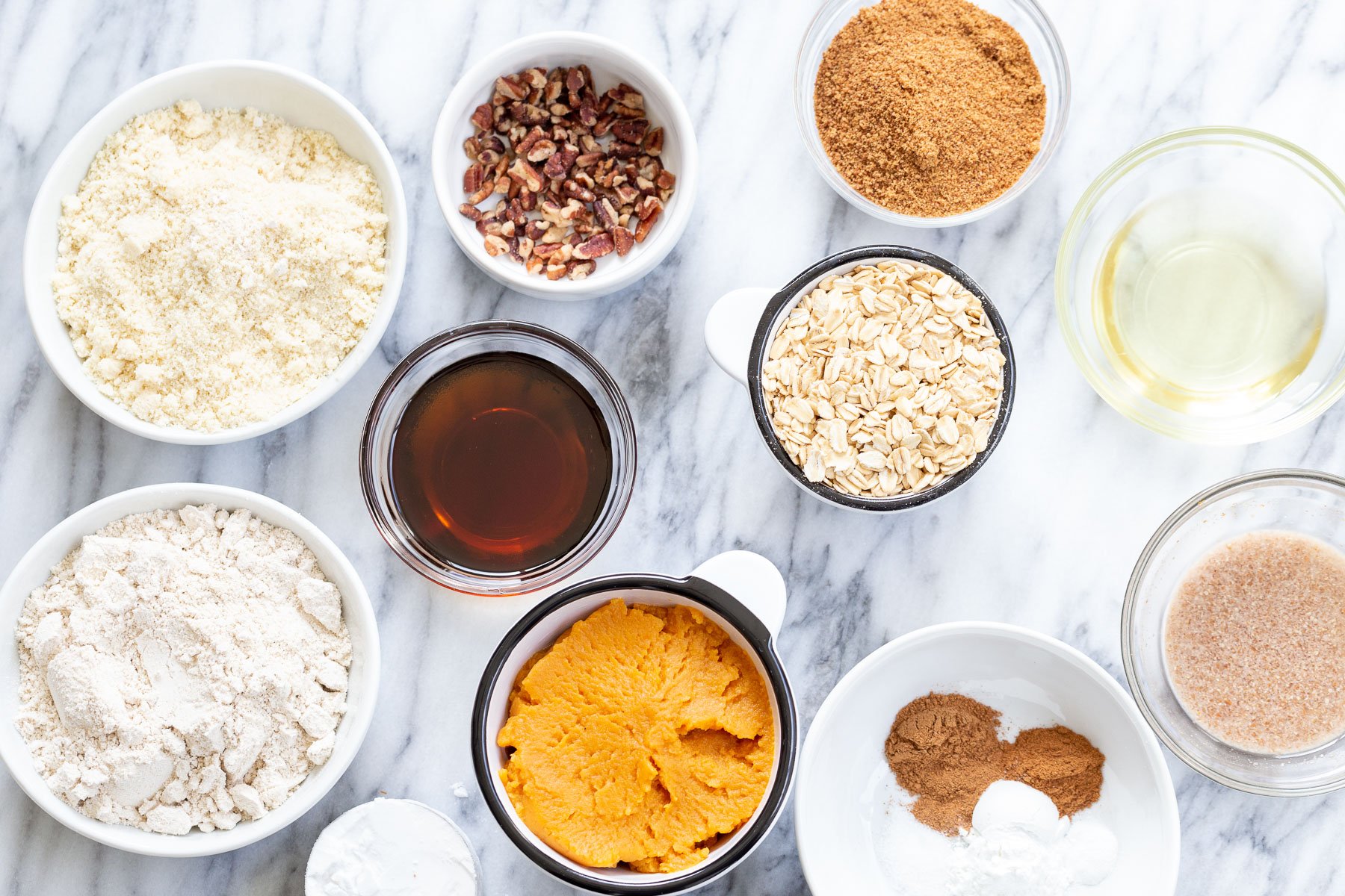 ingredients for pumpkin muffins laid out on table