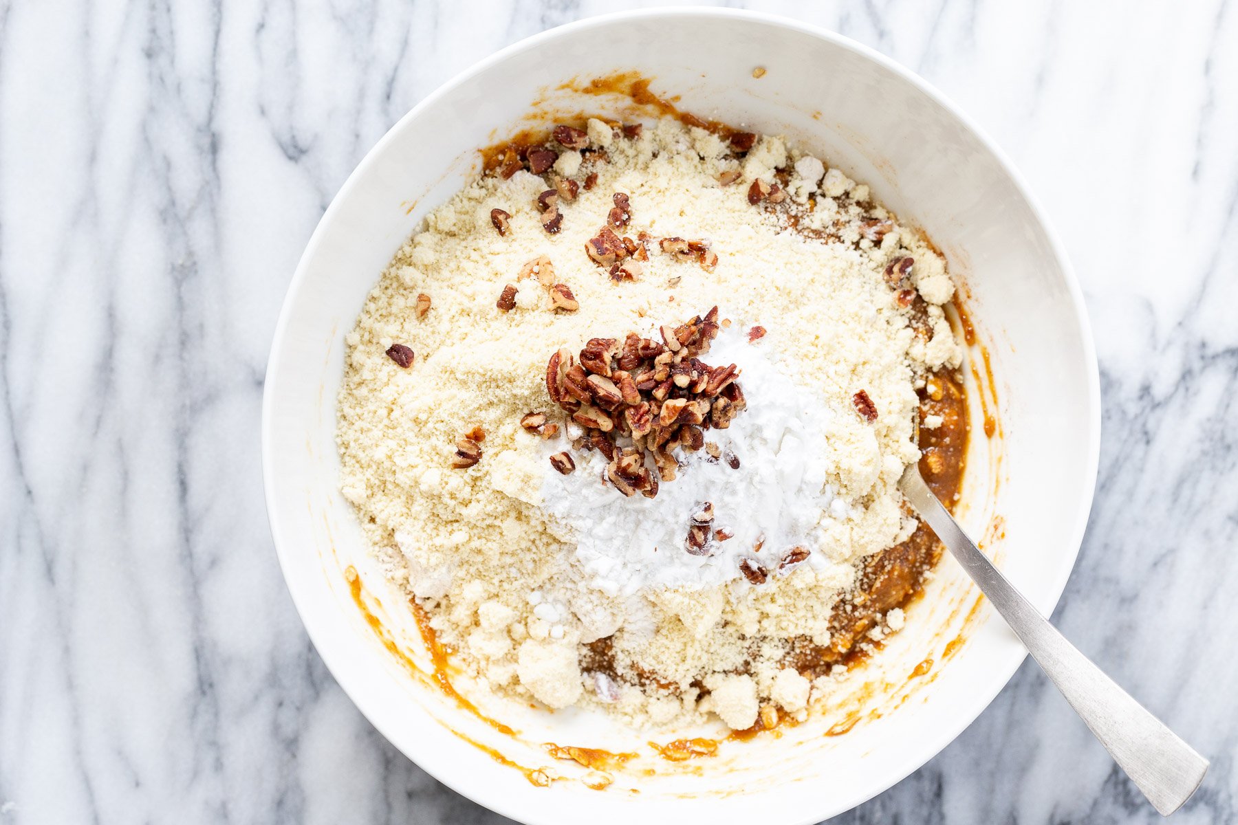 Ingredients for Pumpkin Muffins in white bowl