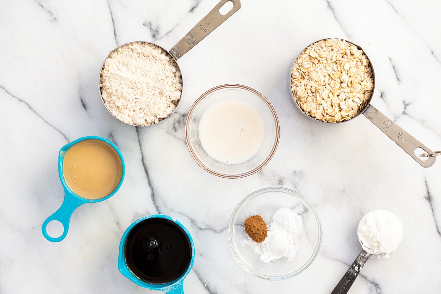 Ingredients for our Gluten-free Tahini Oatmeal cookie in bowls
