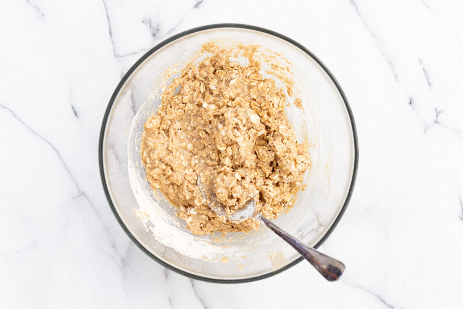 Dough for our Tahini Oatmeal Cookie in a glass bowl