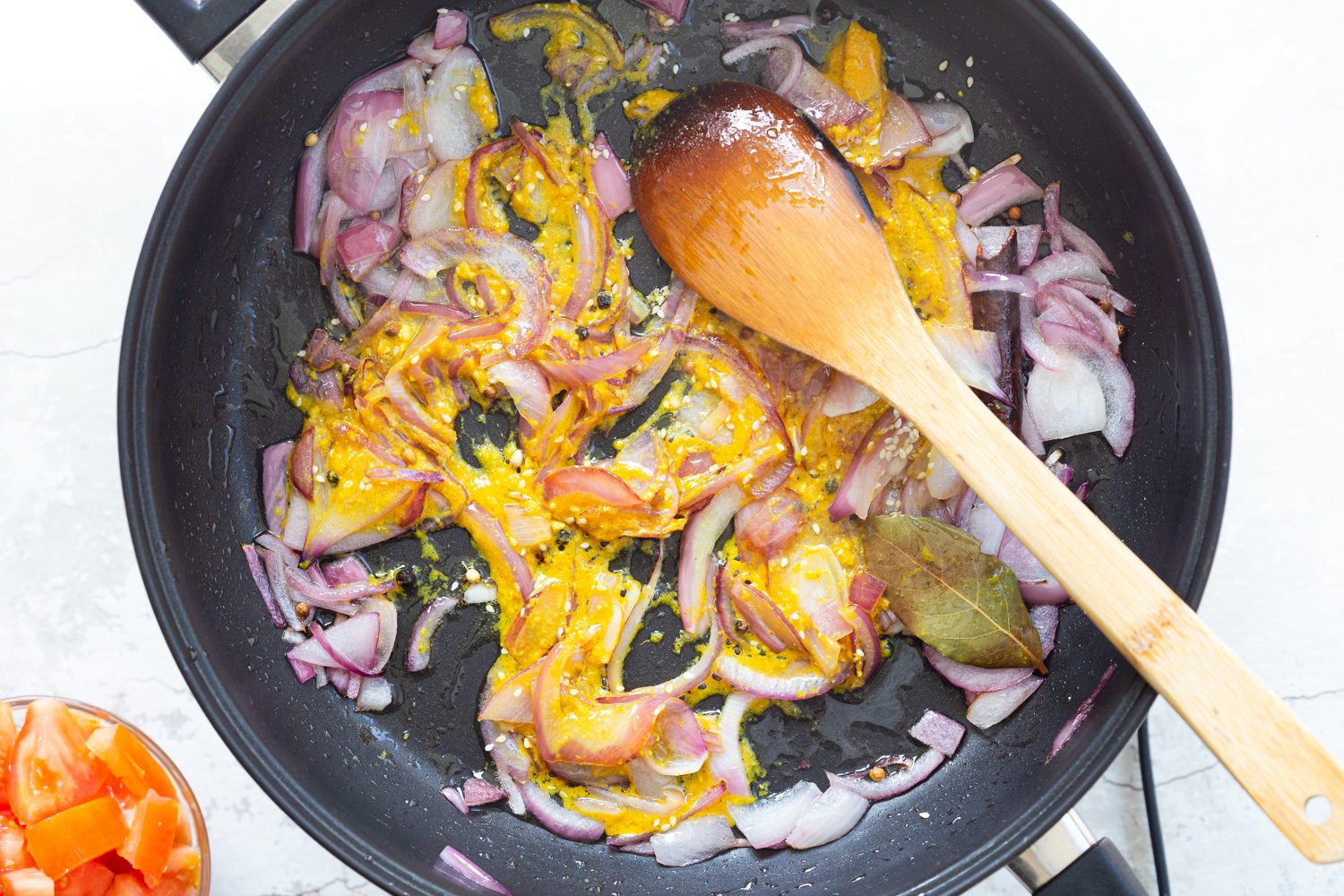 Ingredients for Kohlapuri sauce in black skillet