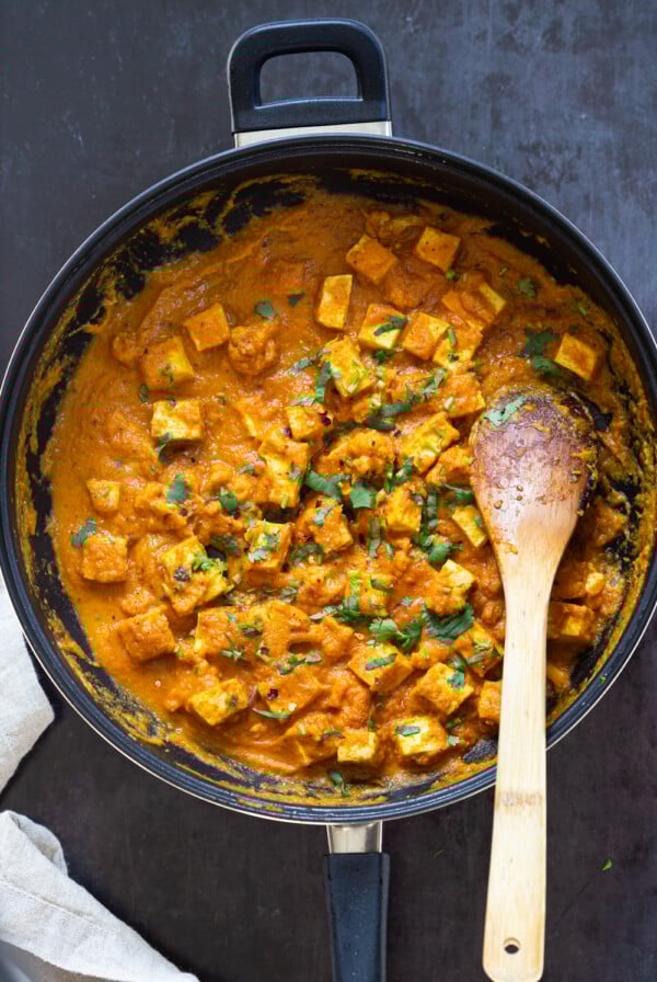 Tofu and Cauliflower in Kohlapuri Sauce in a Black skillet