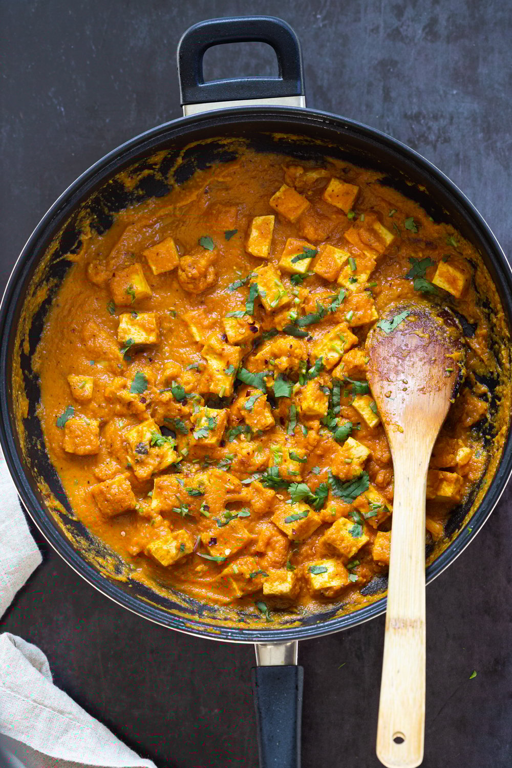 Tofu and Cauliflower in Indian Kolhapuri Sauce in a Black skillet
