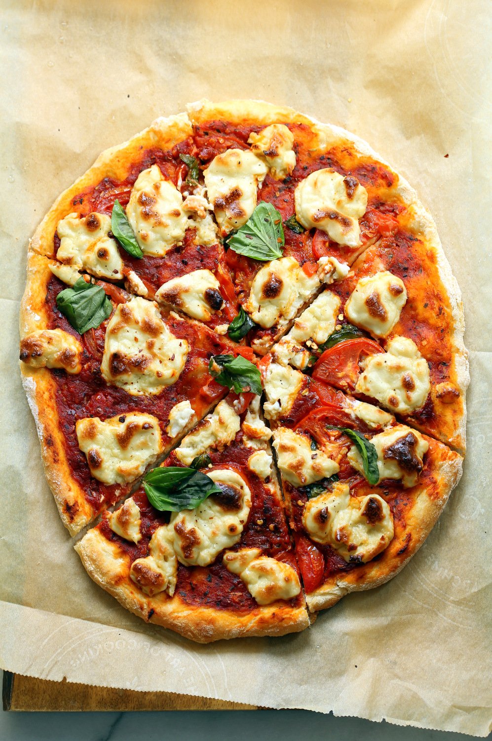 Our Vegan Margherita Pizza on parchment