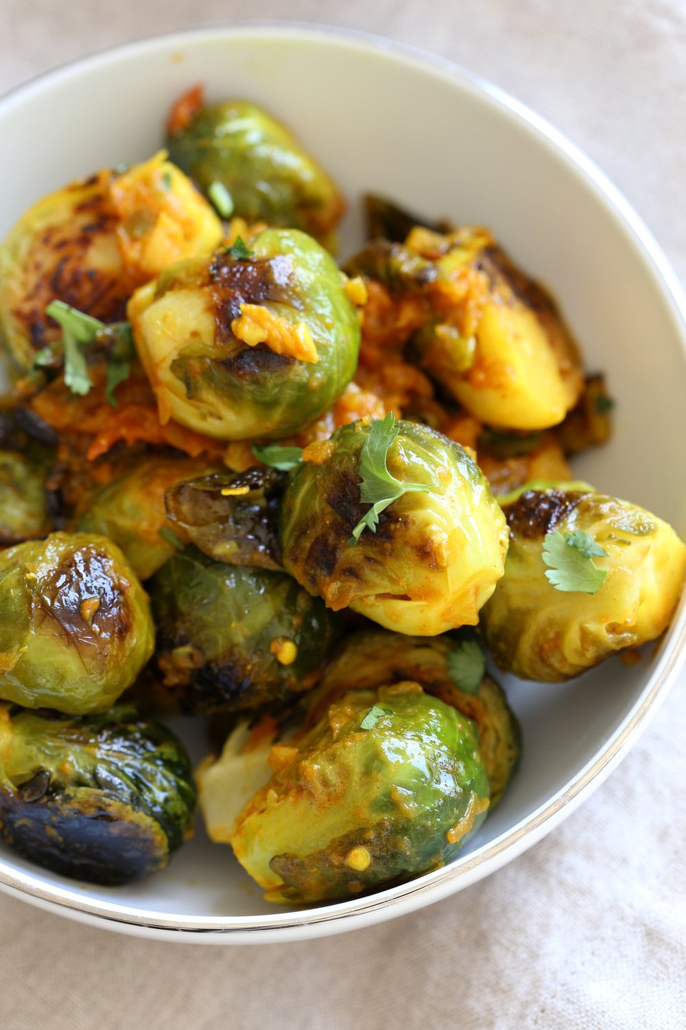 Our Curried Caramelized Brussels Sprouts in White Bowl