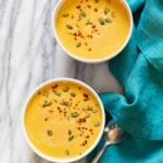 Our Creamy Vegan Pumpkin soup in white bowls