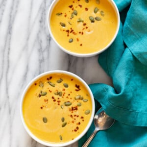 Our Creamy Vegan Pumpkin soup in white bowls