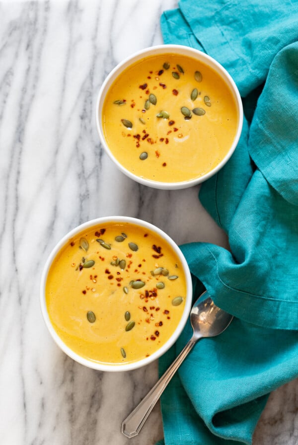 Our Creamy Vegan Pumpkin soup in white bowls