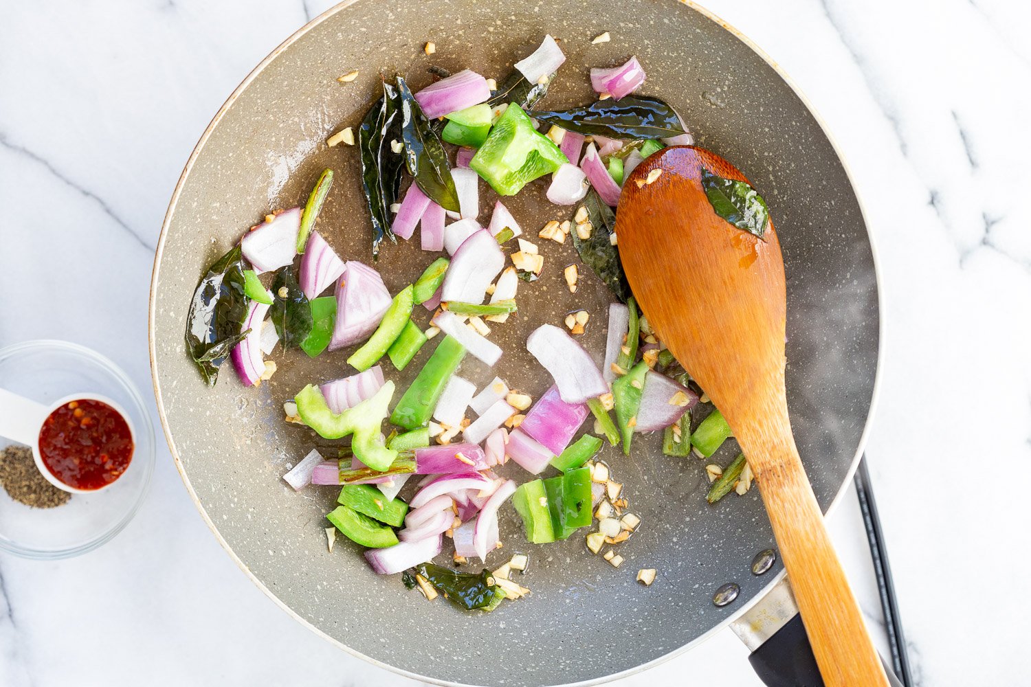 Sauce for Tofu 65 in a grey skillet