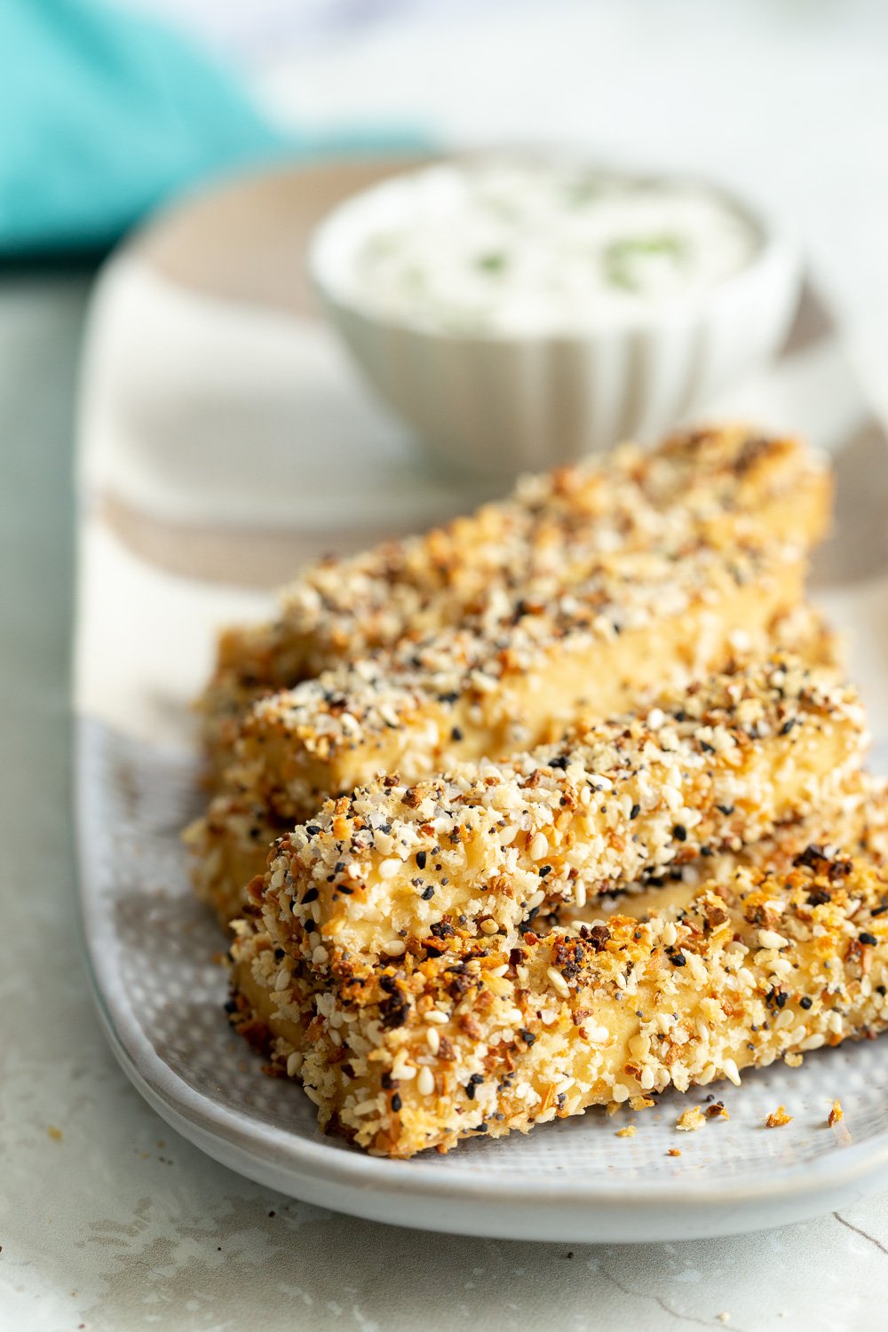 Our Everything Bagel Tofu on a white and grey serving platter