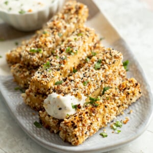 Our Everything Bagel Tofu on a white and grey serving platter