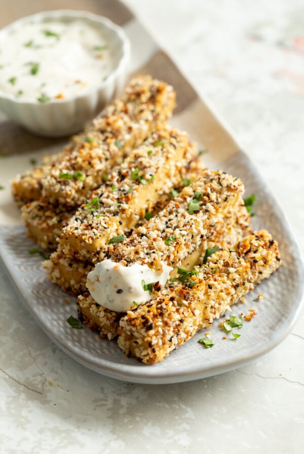Our Everything Bagel Tofu on a white and grey serving platter