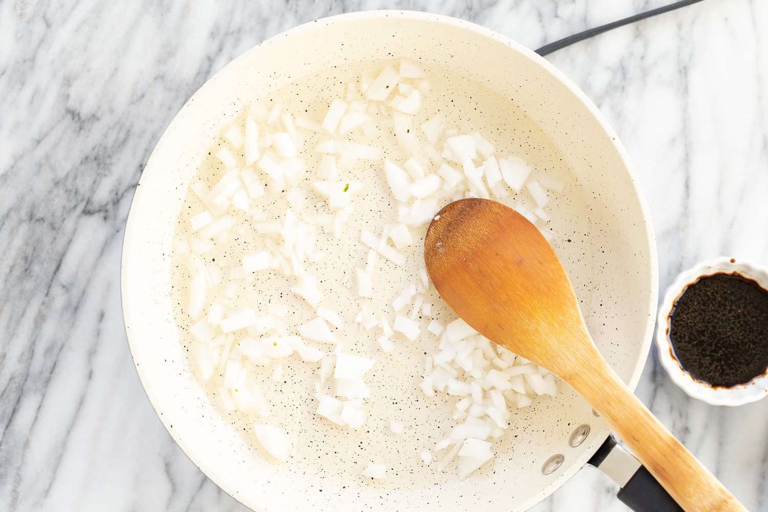 Onions in a white skillet