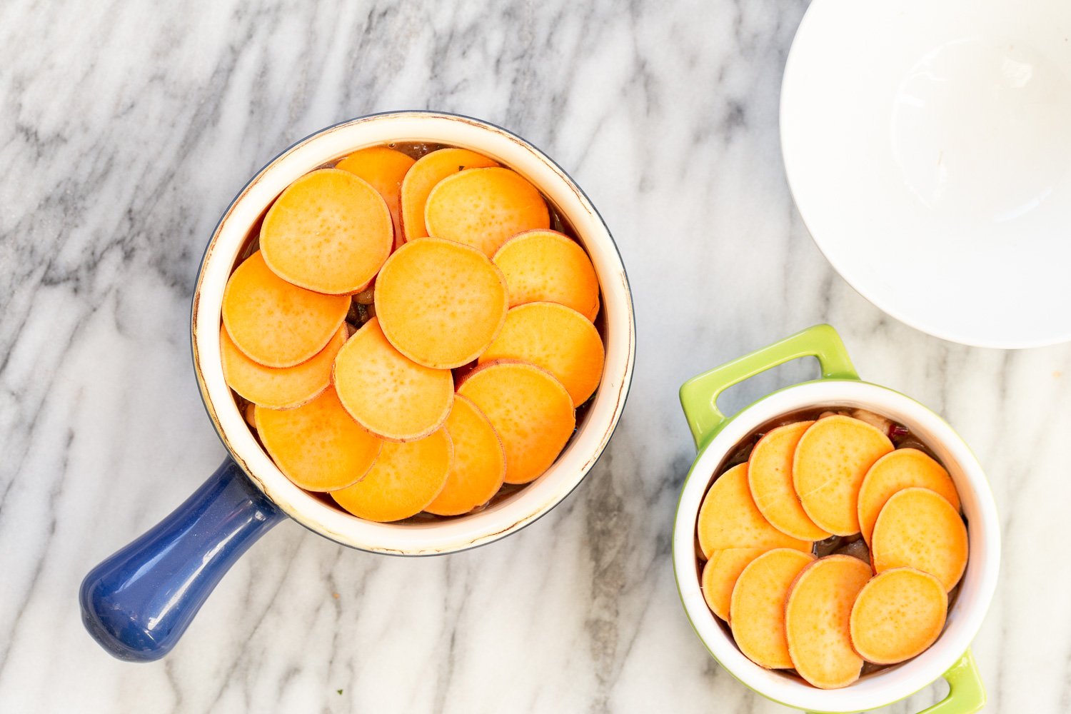 Our Vegan Mushroom Pot Pie in green and blue baking dishes