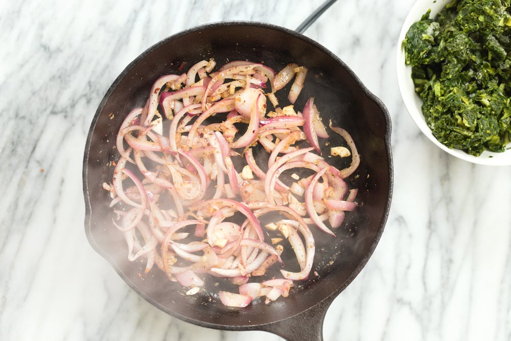 onion and garlic in cast iron skillet