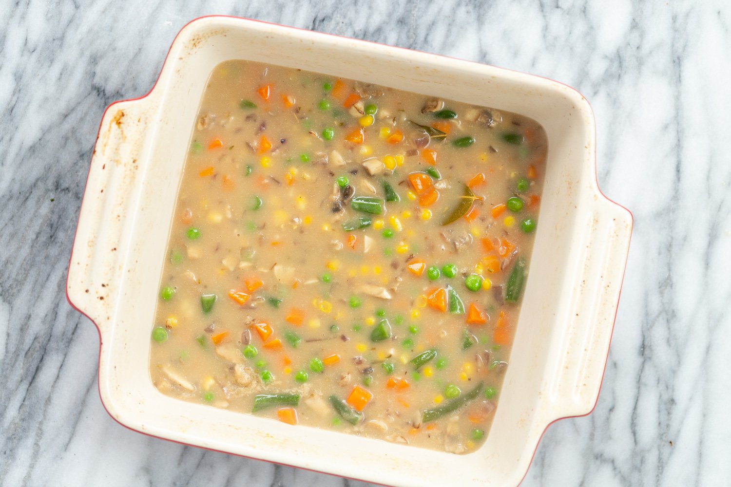 Our Vegan Pot Pie in an off- white baking dish