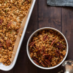 Our Maple Pecan Granola in white bowl and baking dish
