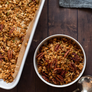 Our Maple Pecan Granola in white bowl and baking dish