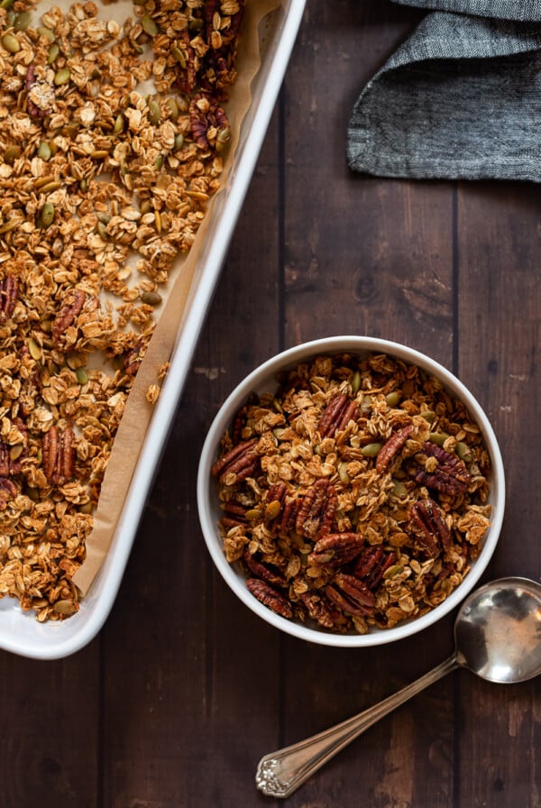 Our Maple Pecan Granola in white bowl and baking dish
