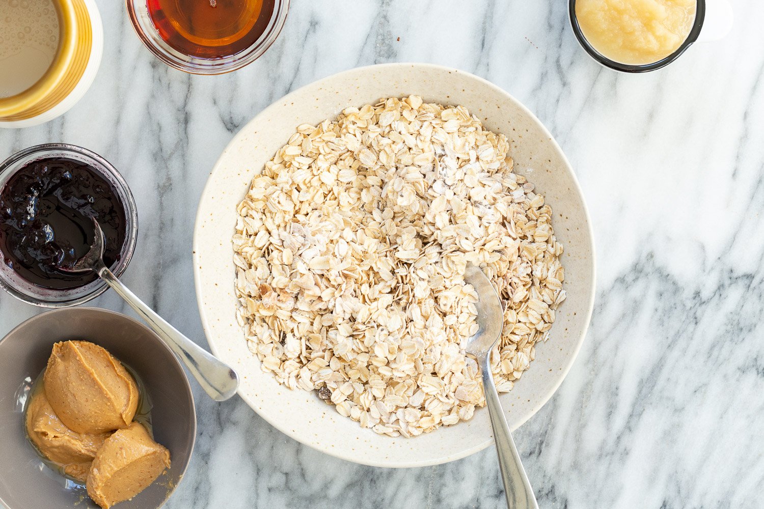 Ingredients for Peanut Butter and Jelly Oatmeal in Bowls