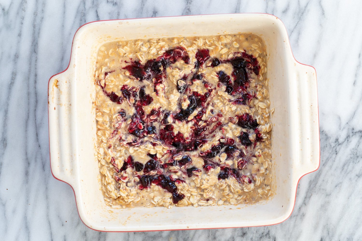 Peanut Butrer And Jelly Oatmeal in a white baking dish