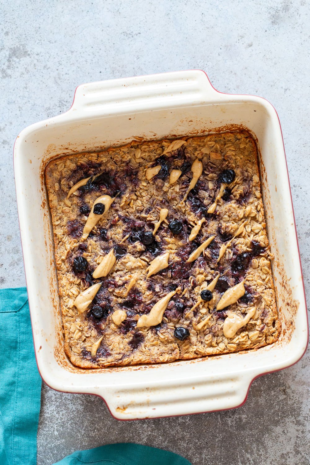 Peanut Butrer And Jelly Oatmeal in a white baking dish