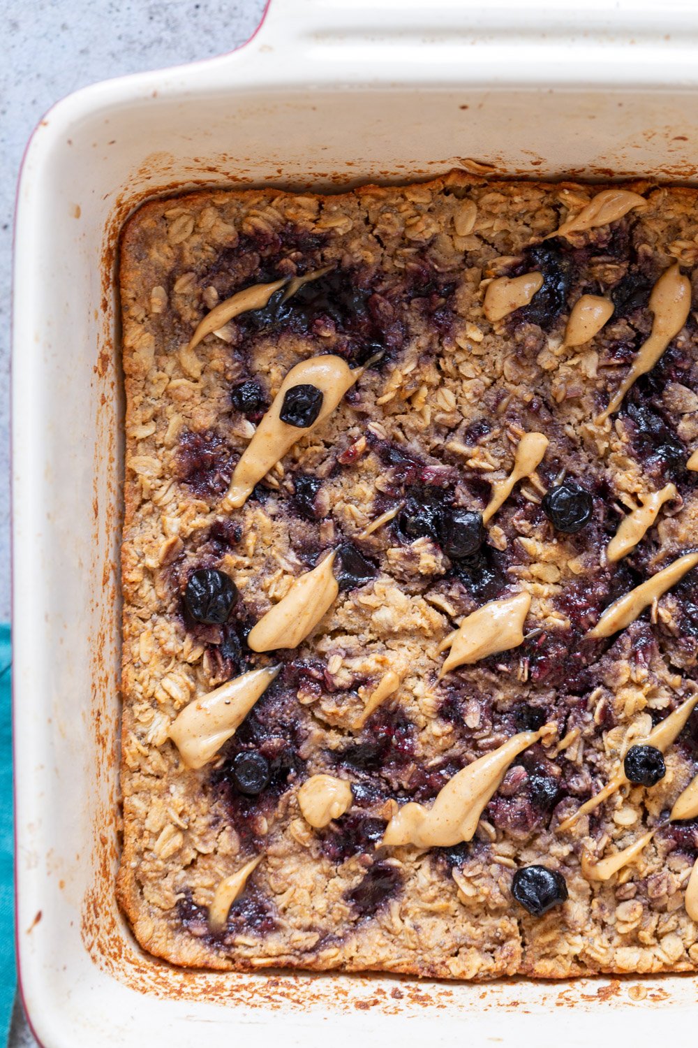 Peanut Butrer And Jelly Oatmeal in a white baking dish