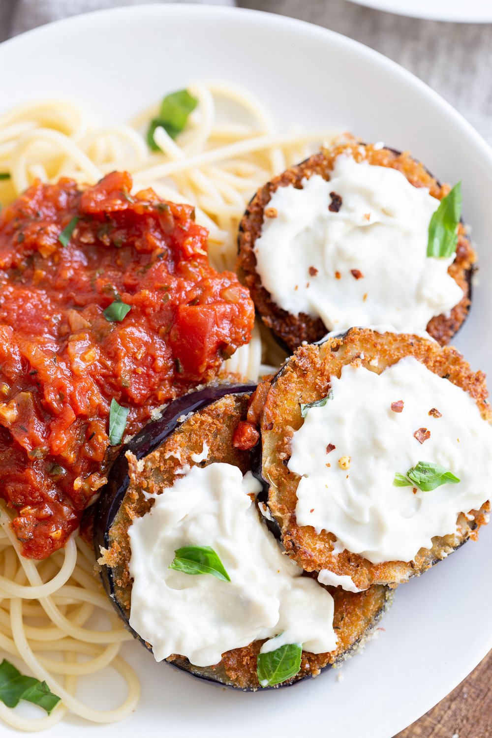 Vegan Eggplant Parmesan on a white plate