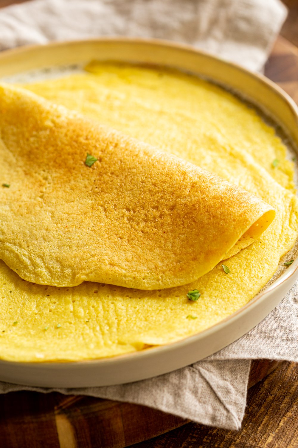 Plain Vegan Omelet made with Mung Beans on a white plate