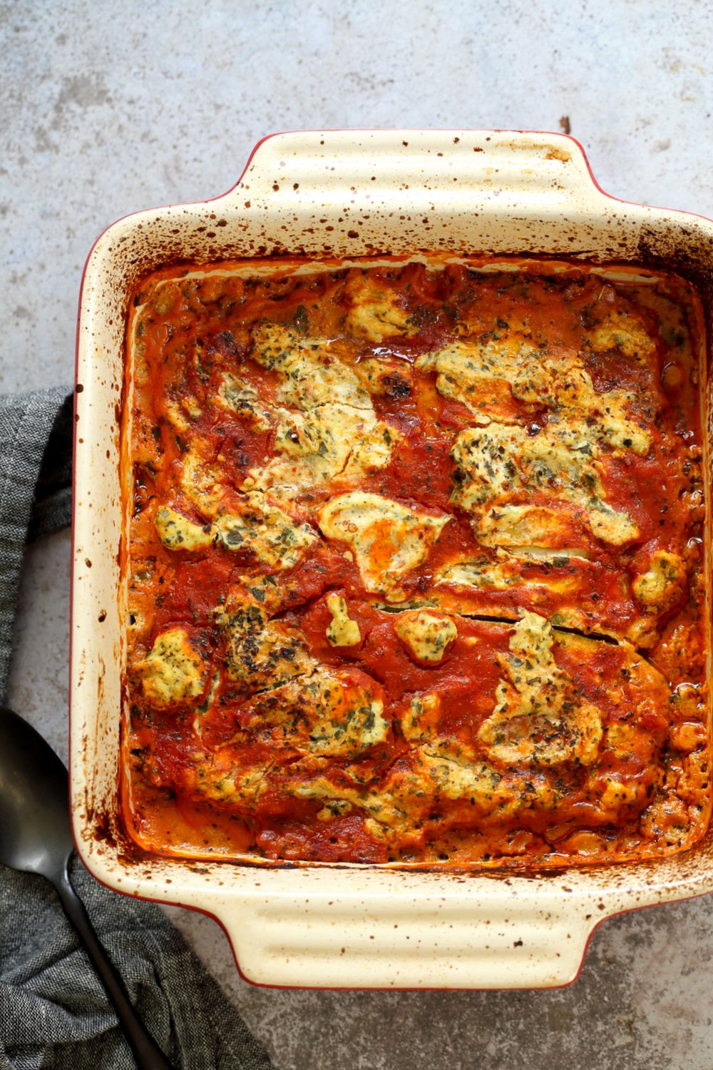 Our Vegan Gluten free Zucchini Lasagna in a cream baking dish