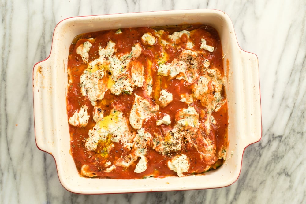 Our Vegan Gluten free Zucchini Lasagna in a cream baking dish