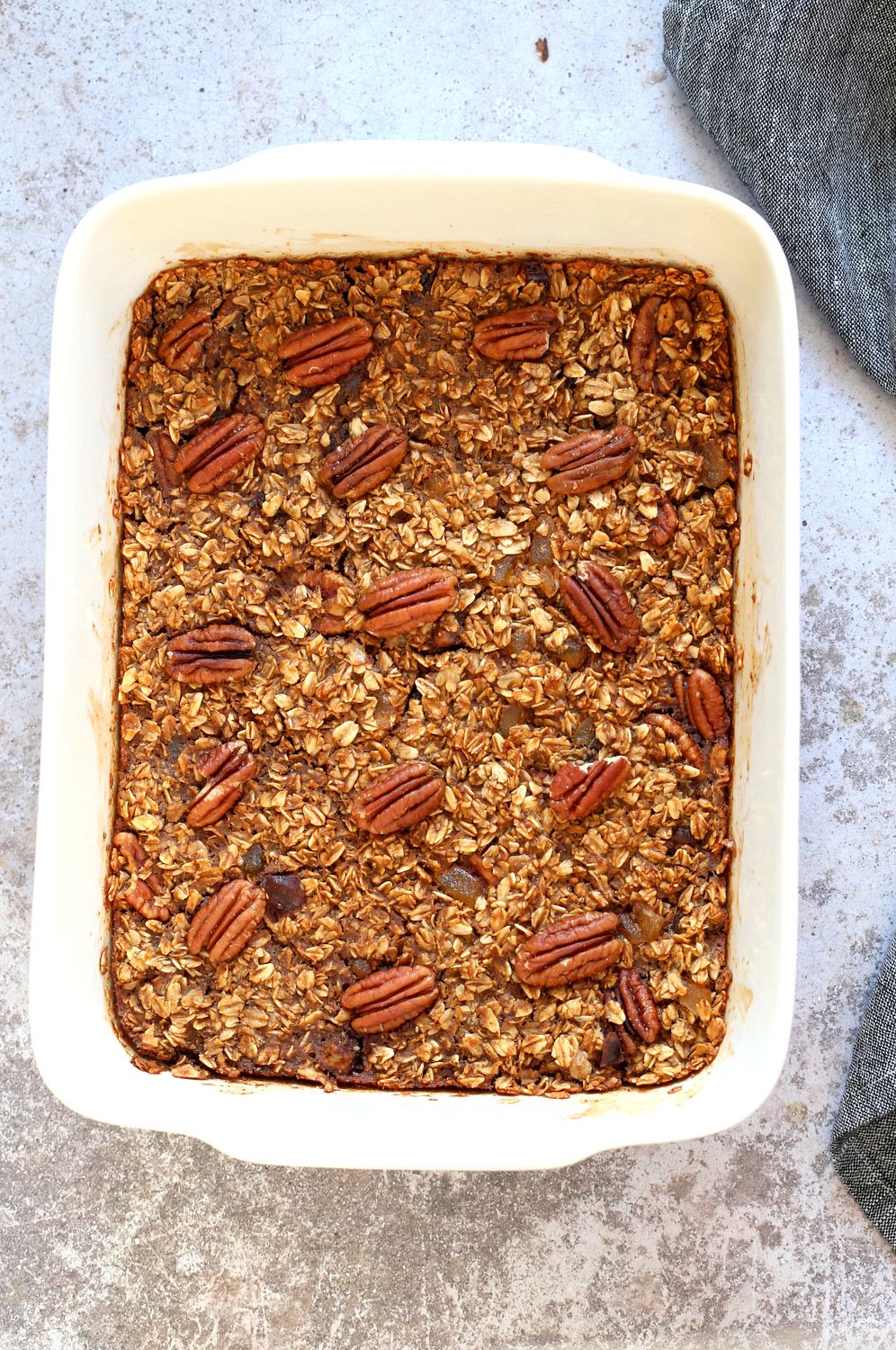 Vegan Gingerbread Baked Oatmeal in a white baking dish