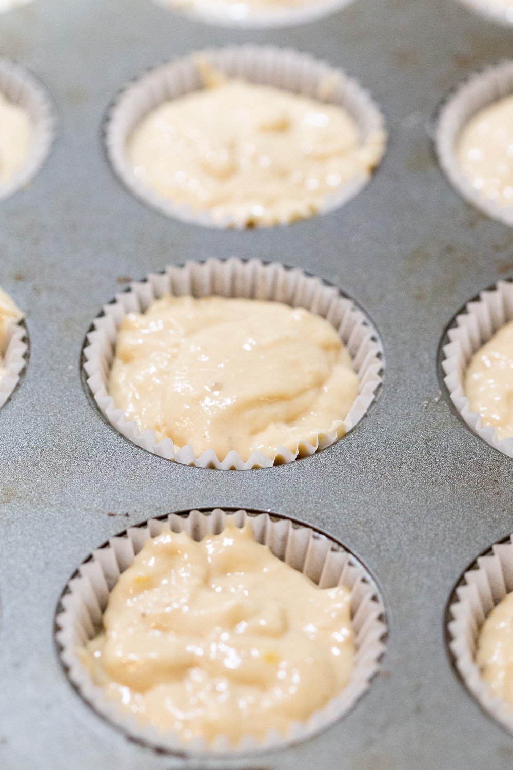 Vegan Banana muffin batter in muffin tin